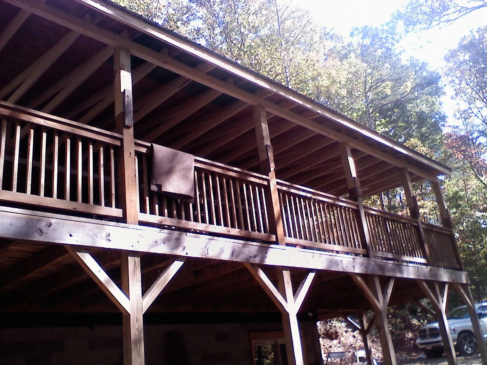 Timber framing under a new elevated porch and deck — Roof Leak Repair in South Deerfield by Roofing Brothers